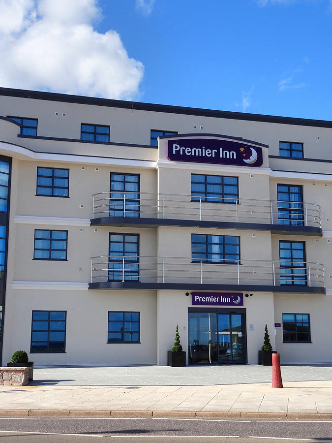 Image of modern Premier Inn Hotel exterior by Exmouth beach Photograph by Mtreasure