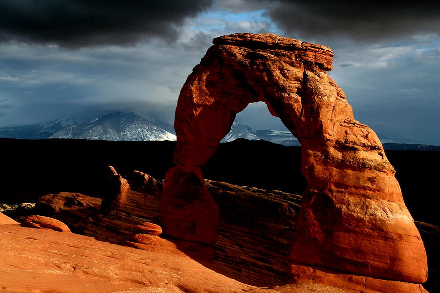 Incoming storm at Delicate Arch at Arches National Park Photograph by Jetson Nguyen