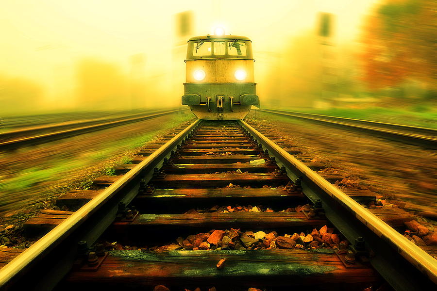 Incoming train Photograph by Jaroslaw Grudzinski