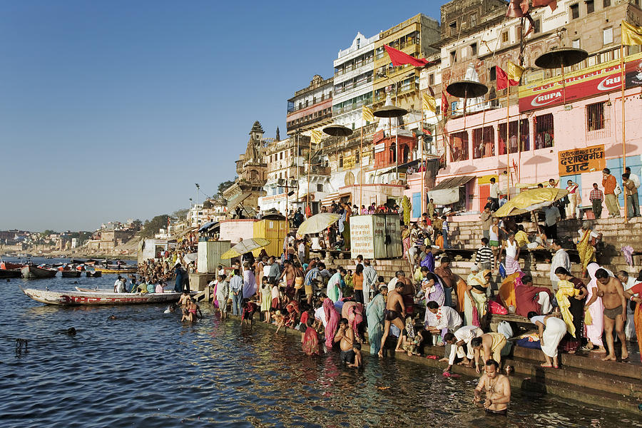 India, Varanasi, Ganges River, pilgrims on ghats Photograph by Martin Harvey