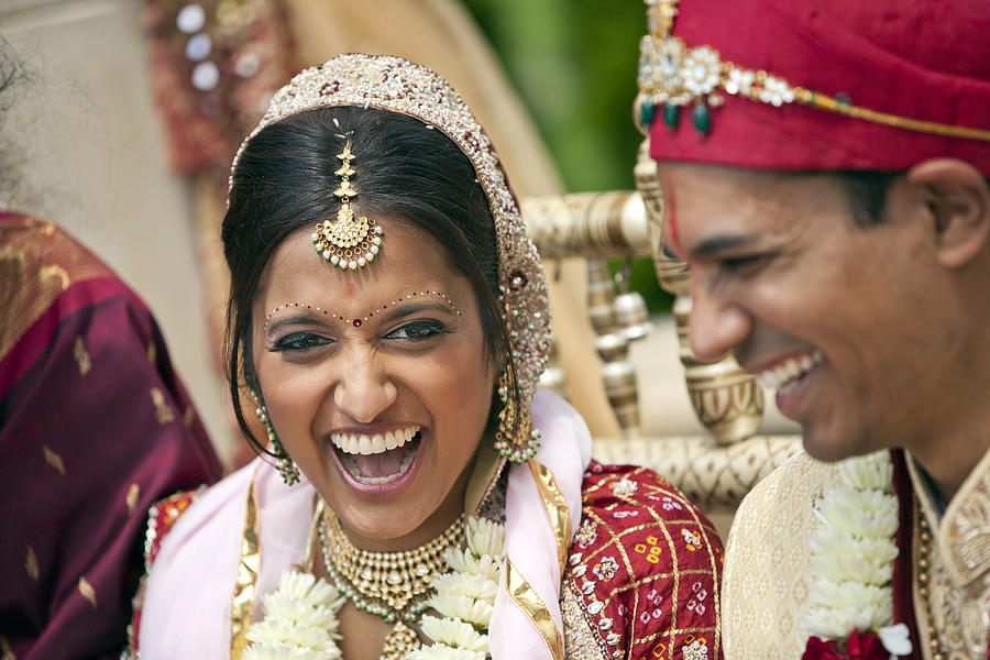 Indian bride and groom in traditional clothing Photograph by Jihan Abdalla