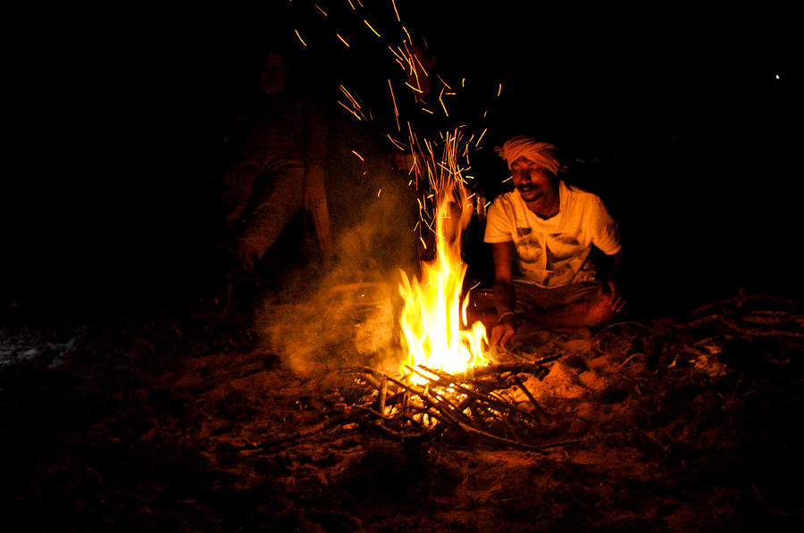 Indian chef cooking on fire.  Photograph by Diane Lent