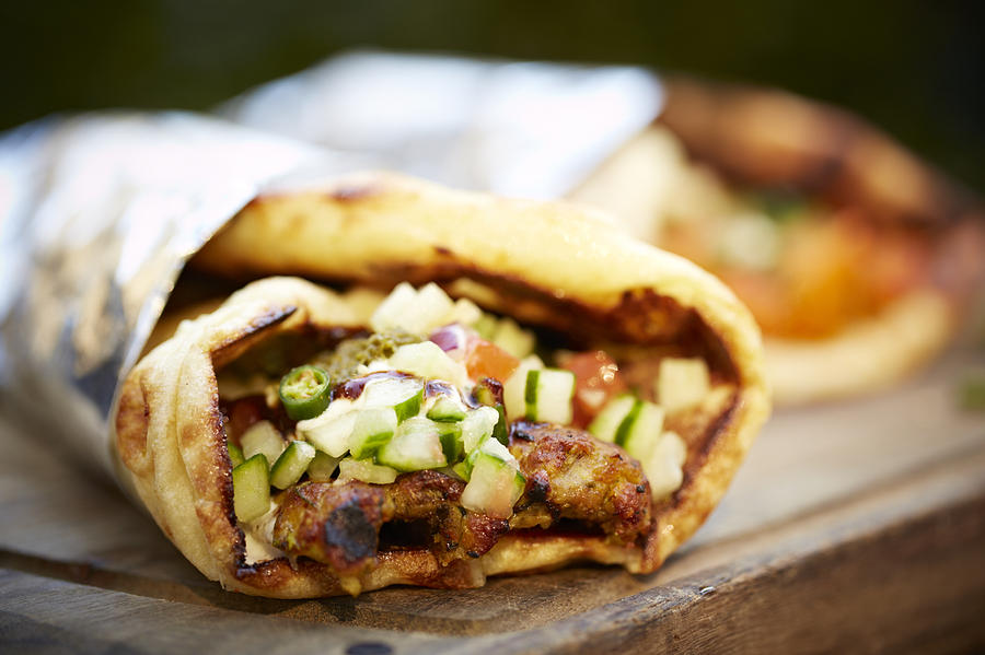 Indian lamb kebab wrap on food truck Photograph by Tracey Kusiewicz/Foodie Photography