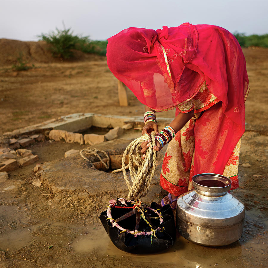 Indian Woman Getting Water From The Photograph by Hadynyah