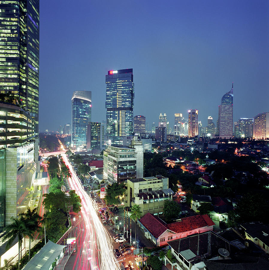 Indonesia, Jakarta Skyline At Dusk Photograph by Martin Puddy