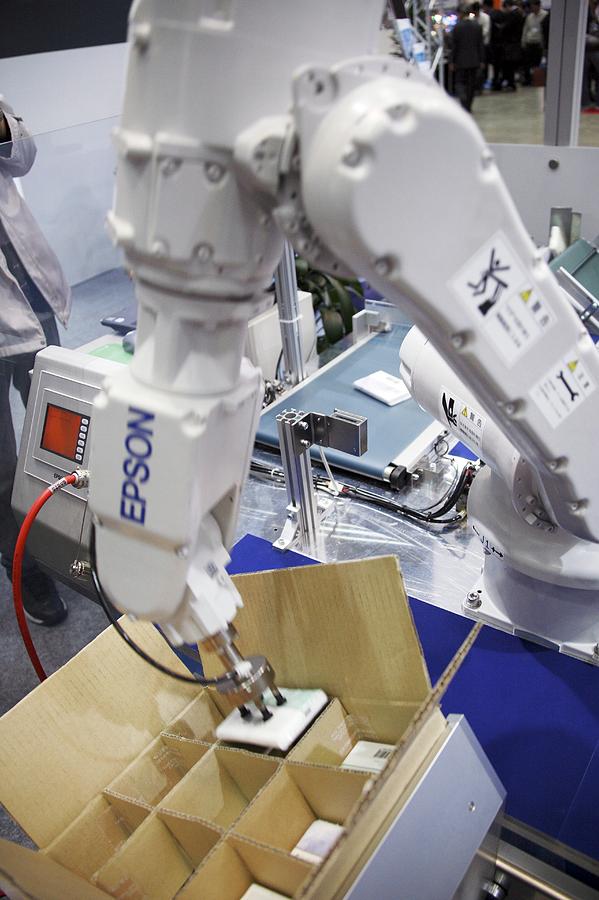 Industrial Production Line Robot Photograph by Andy Crump/science Photo Library