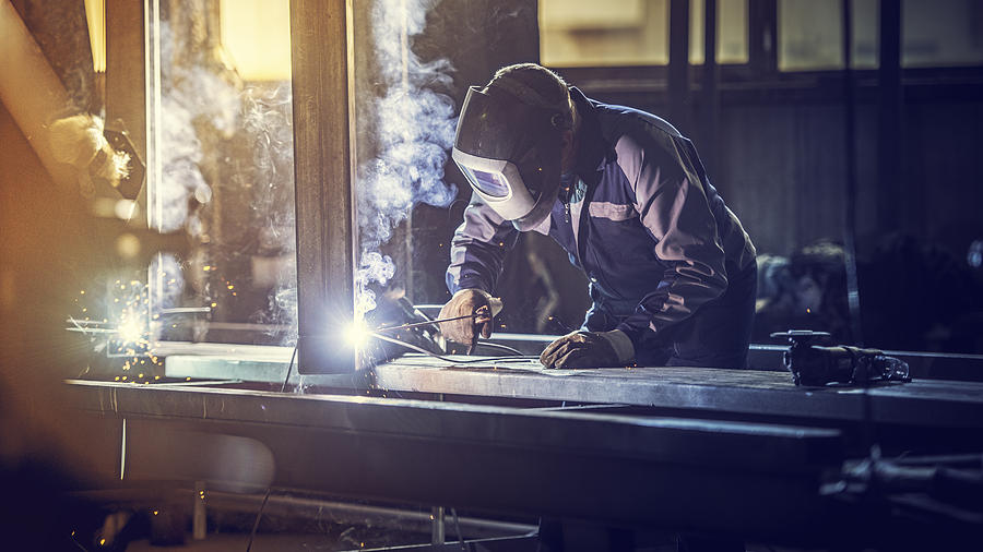 Industrial worker with welding tool Photograph by Vm