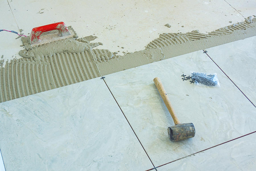 Installation of New Tiles on a Bathroom Floor Photograph by Kryssia Campos