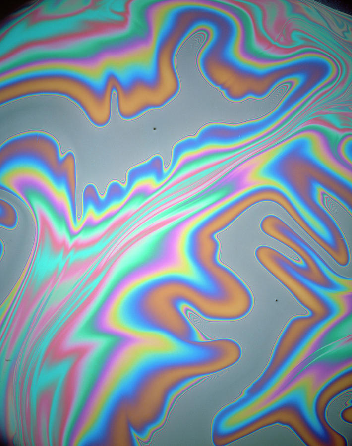 Interference Pattern Of Oil Film On Water Photograph by Peter Aprahamian/science Photo Library