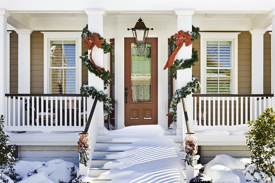 inviting Christmas front doorway with snow on porch stairs Photograph by Dszc