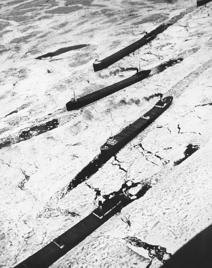 Black And White Photograph - Iron Ore Boats Stuck In Ice by Underwood Archives