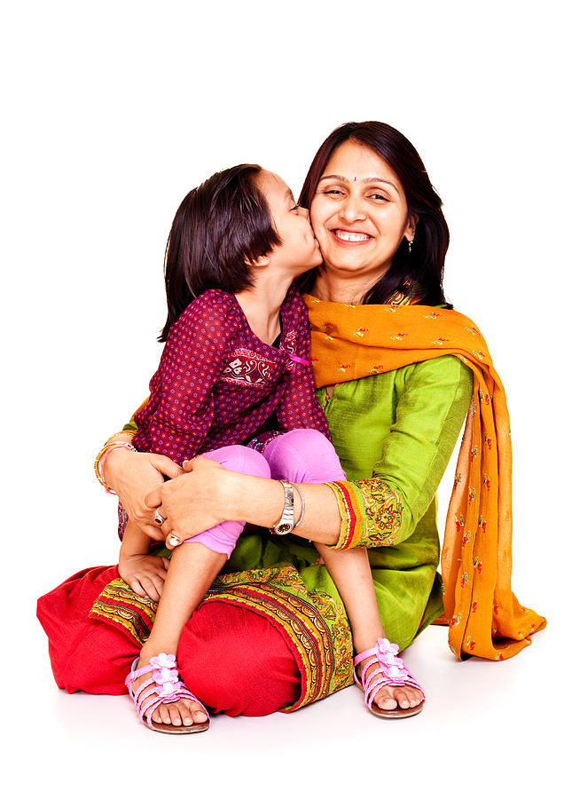 Isolated Portrait of Affectionate Cheerful Indian Mother and Daughter Kissing Photograph by VikramRaghuvanshi