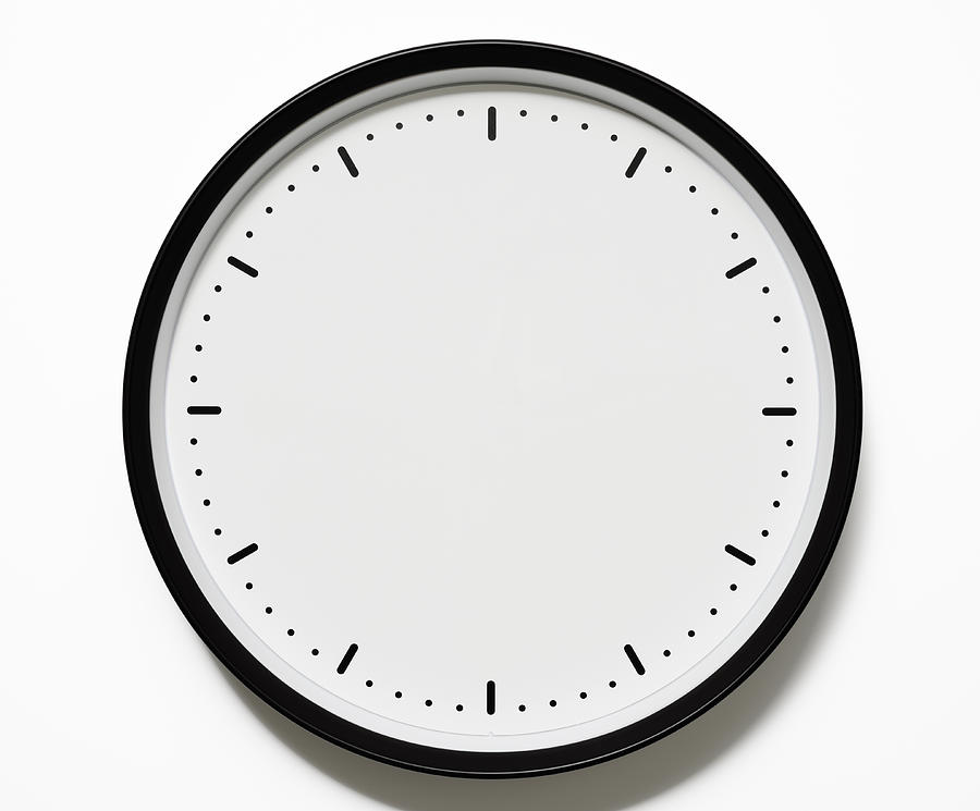 Isolated shot of blank clock face on white background Photograph by Kyoshino