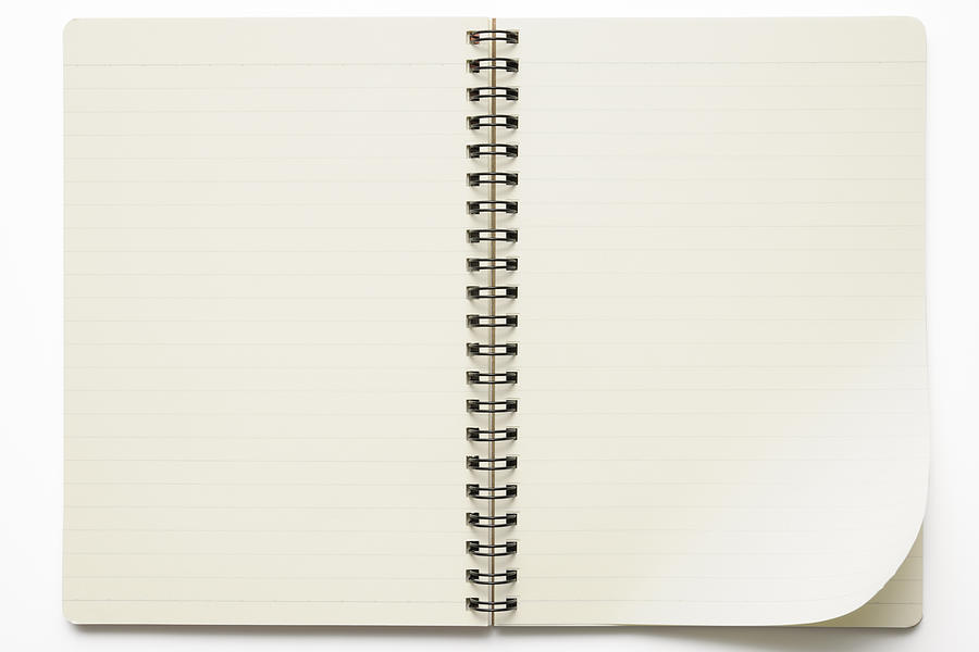 Isolated shot of opened spiral notebook on white background Photograph by Kyoshino