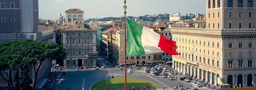 Architecture Photograph - Italian Flag Fluttering With City by Panoramic Images