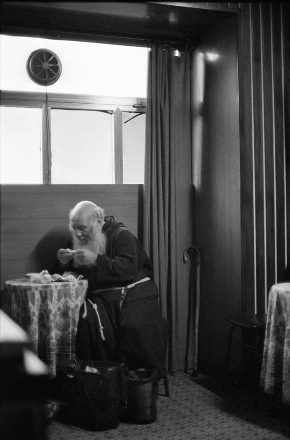 Black And White Photograph - Italian Friar having Lunch by Bernard  Barcos