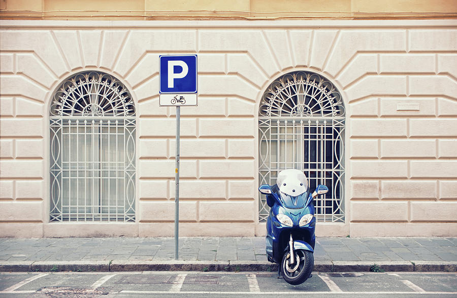 Italian Scooter Parked On The Street Photograph by Marcoventuriniautieri
