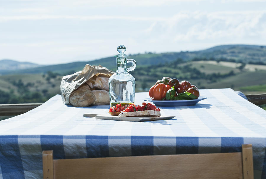 Italy, Tuscany, Magliano, Bruschetta, bread, tomatoes and olive oil on table Photograph by Westend61