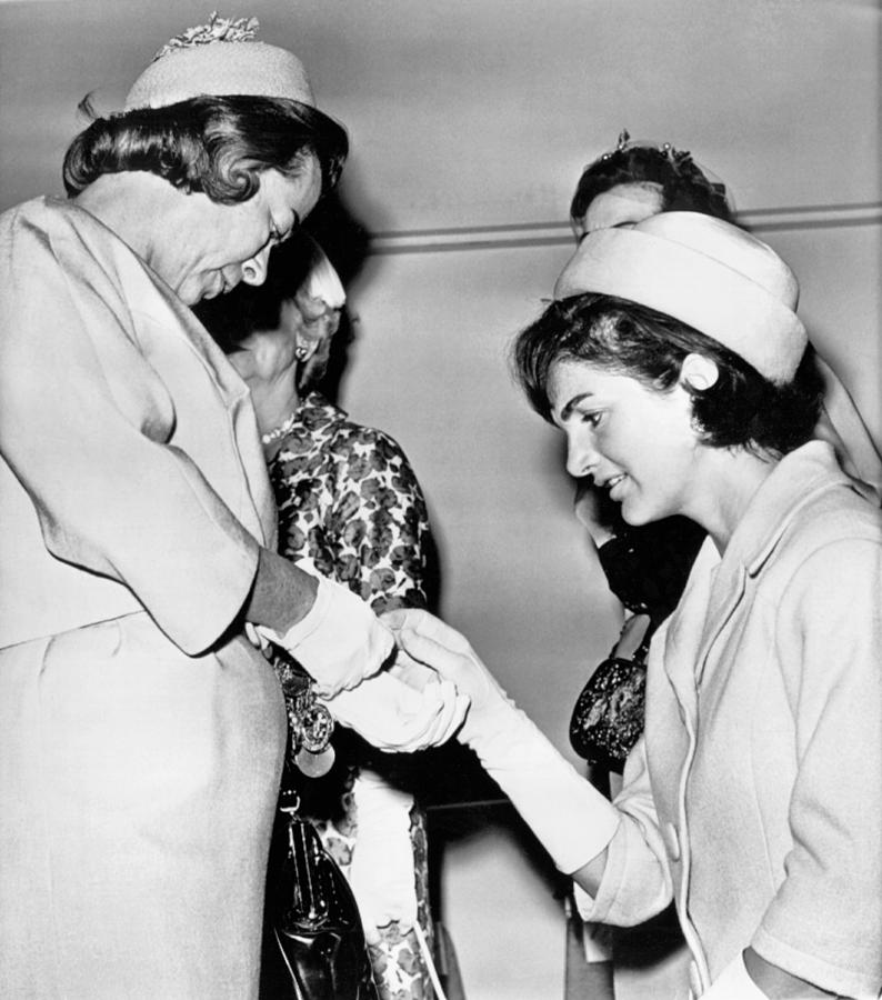 Black And White Photograph - Jackie Inspects Gold Bracelet by Underwood Archives