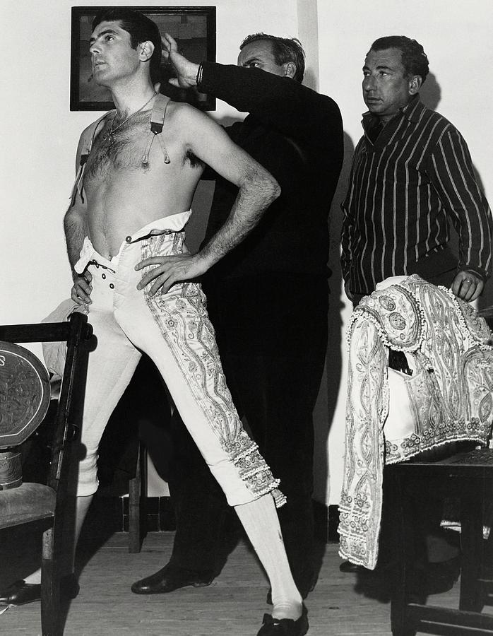 Jaime Ostos Undressing Photograph by Henry Clarke