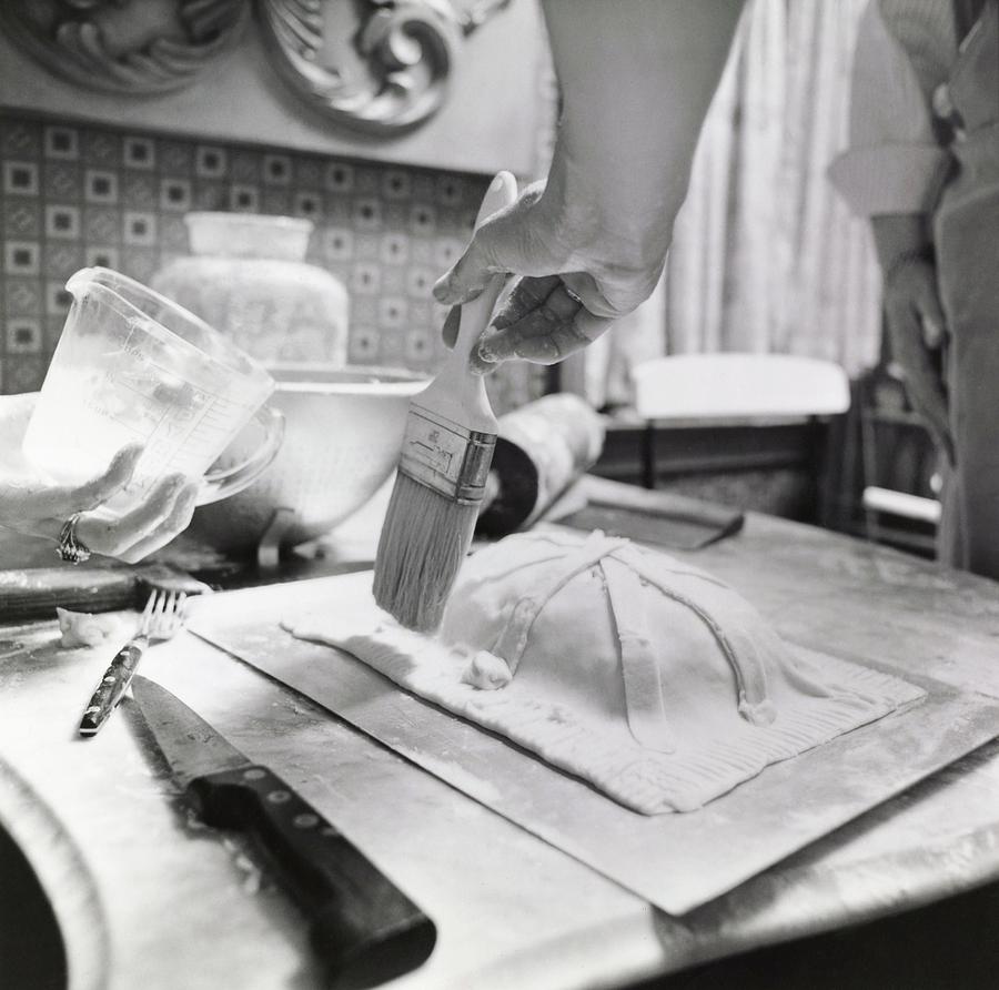 James Beard Basting Pastry Photograph by Ernst Beadle