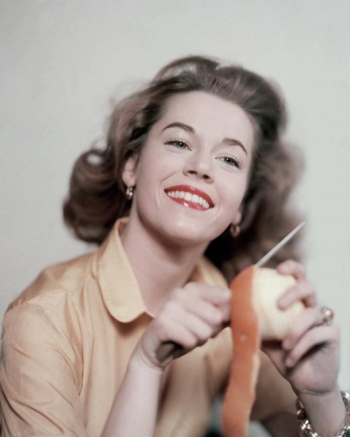 Jane Fonda Peeling An Orange Photograph by Karen Radkai