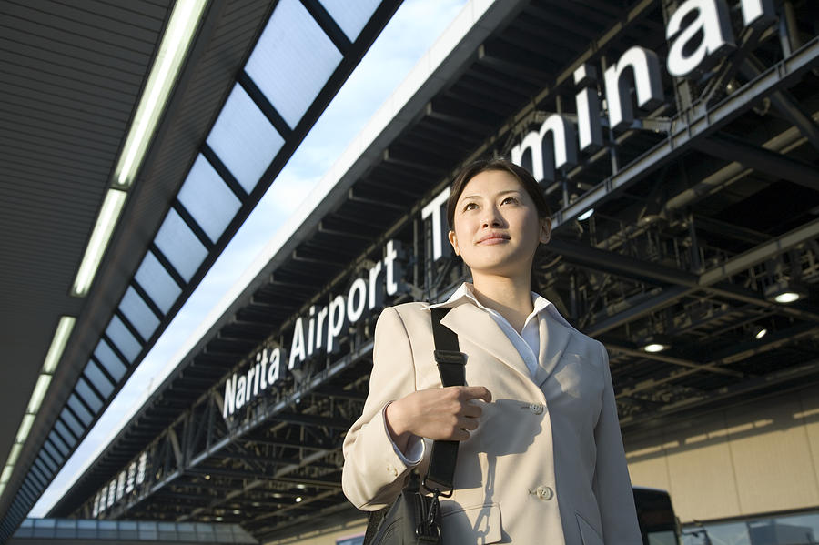 Japan, Chiba Prefecture, young businesswoman at Narita Airport Photograph by Ichiro