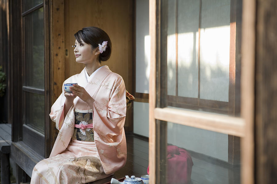 Japan, Tokyo, woman in kimono drinking tea Photograph by Michael H