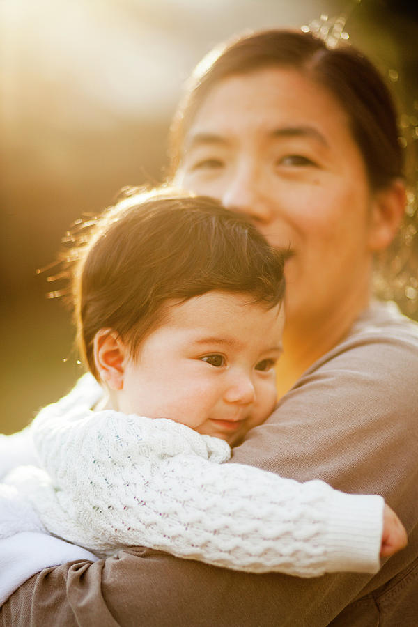 Japanese American Mother Holding Baby Photograph by Steve Glass Japanese American Mother Holding Baby Photograph by Steve Glass