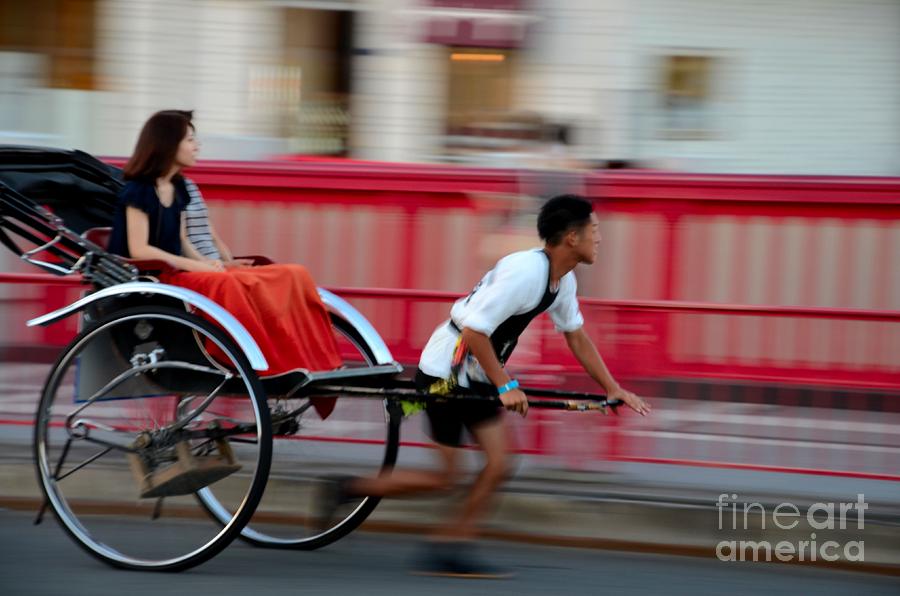Rickshaw Photograph - Japanese tourists ride rickshaw in Tokyo Japan by Imran Ahmed