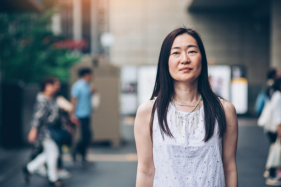 Japanese woman outdoors in the city Photograph by Pixelfit