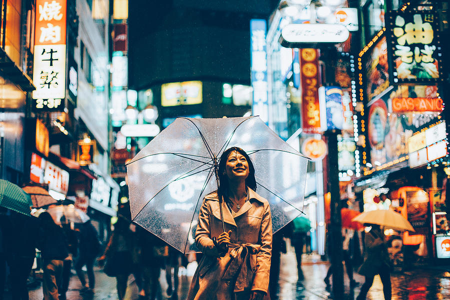 Japanese woman outside in the rain Photograph by Filadendron
