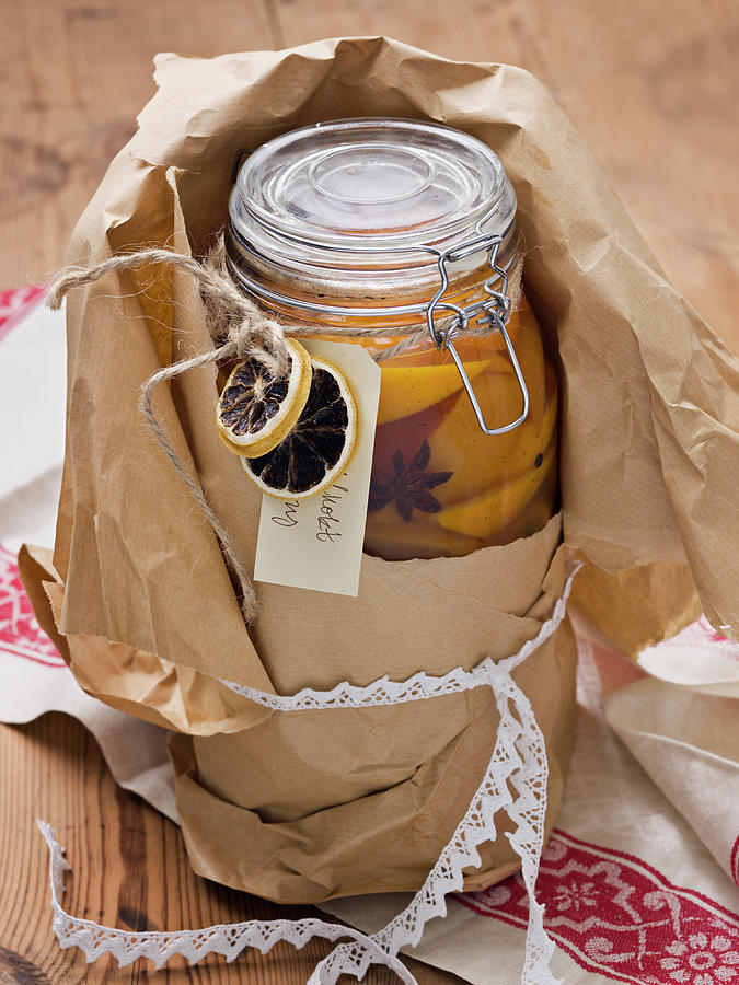 Jar With Preserved Orange Slices Photograph by Johner Images