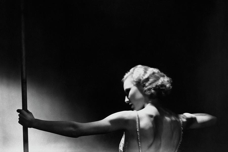 Jean Barry Holding A Pole Photograph by George Hoyningen-Huene