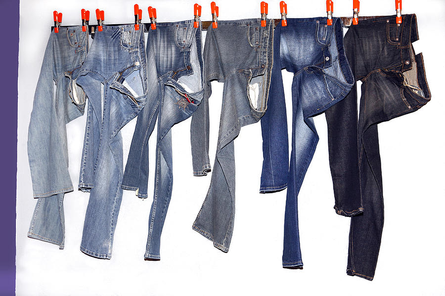 Jeans hanging on string Photograph by Geri Lavrov