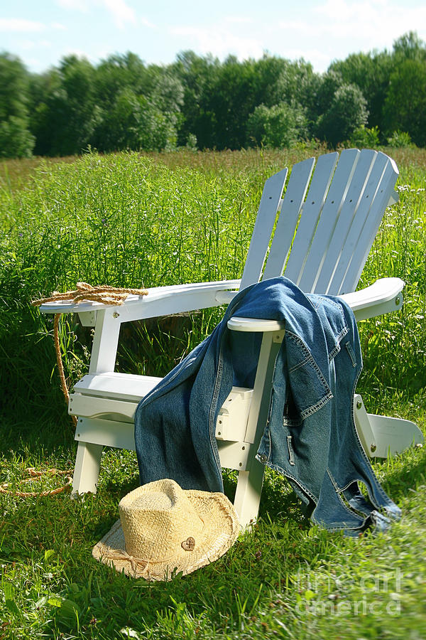 Jeans laying on chair  Photograph by Sandra Cunningham