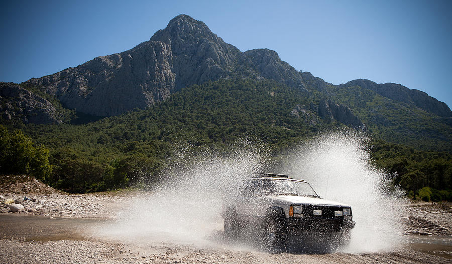 Jeep, Throwing The Water Stream Passing Through Photograph by Okeyphotos