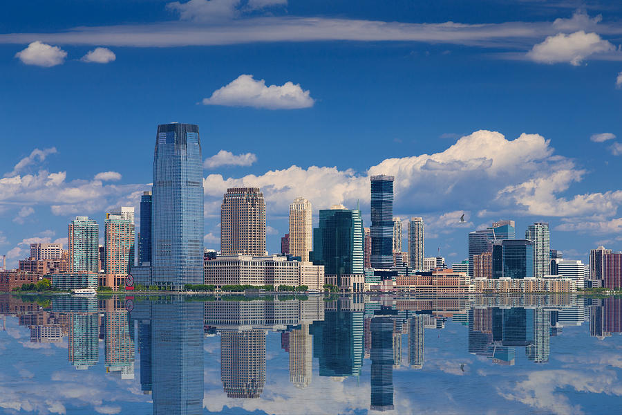 Jersey City Skyline with Goldman Sachs Tower Reflected in Water of Hudson River, New York, USA. Photograph by OlegAlbinsky