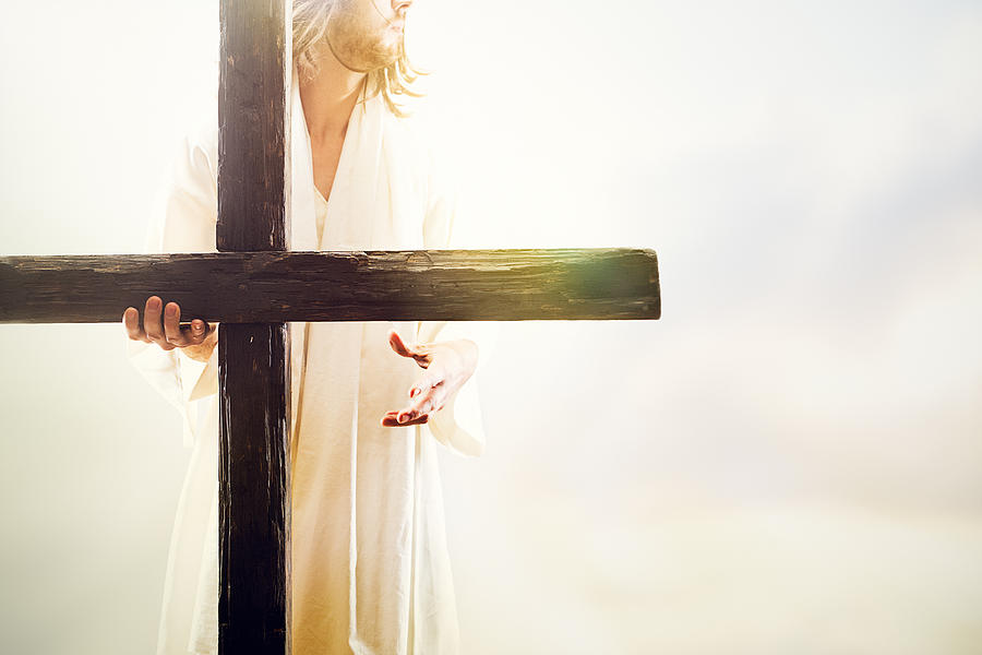 Jesus Christ Holding Cross Photograph by RyanJLane