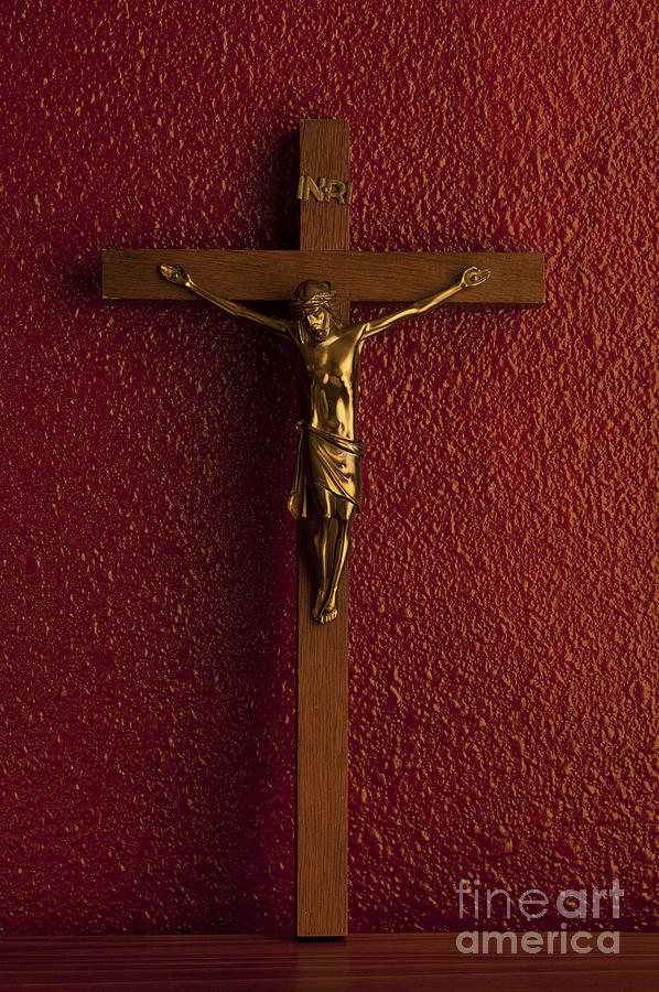 Jesus On Cross Against Red Wall Photograph