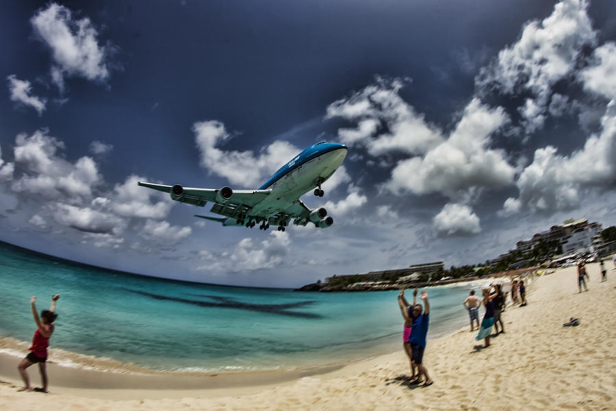 Jet landing over Maho Beach Photograph by Sven Brogren