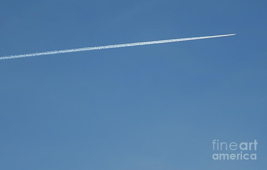 Jet leaving a trail in the sky Photograph by Robert Birkenes