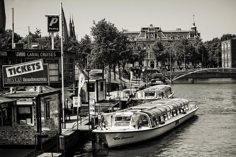 Jetty for the Boat Canal Cruise. Amsterdam Photograph by Jenny Rainbow