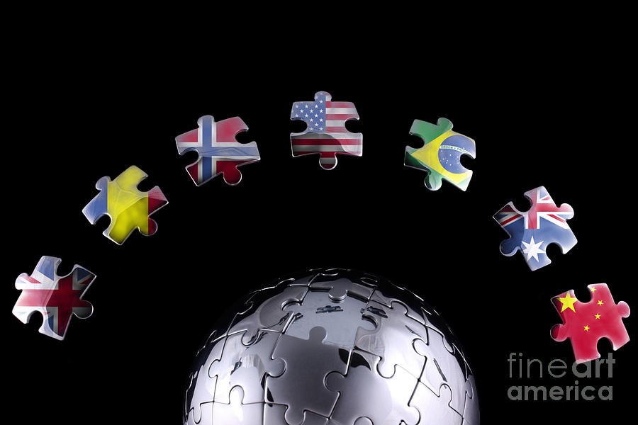 Jigsaw flags around a chrome globe  Photograph by Simon Bratt