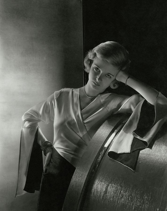 Joan Bennett Leaning On A Barrel Photograph by Cecil Beaton