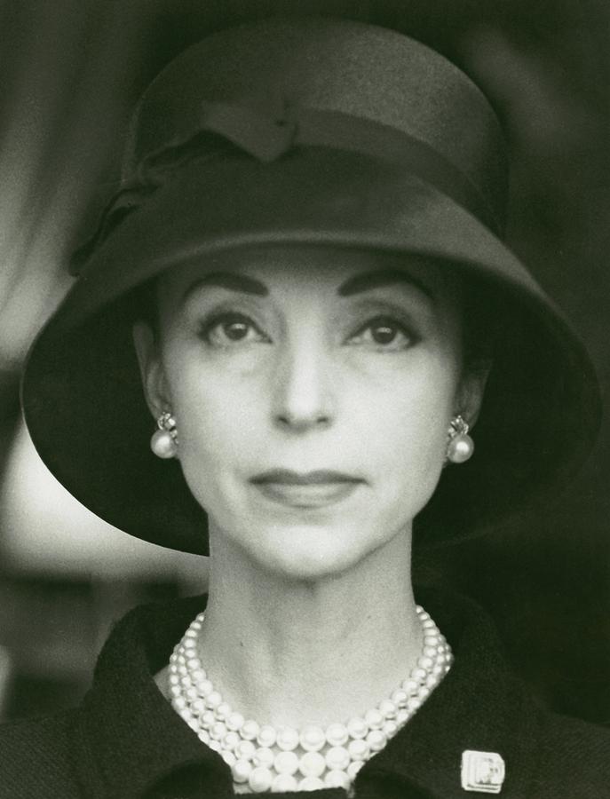 Gloria Guinness Wearing A Hat And Pearls Photograph by Henry Clarke