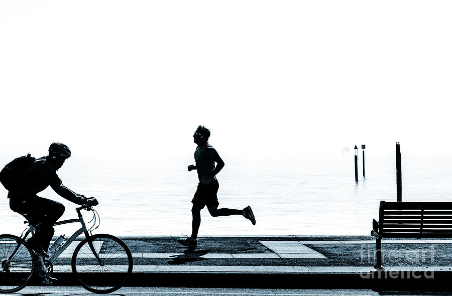 Jogging on the prom. Photograph by Peter Noyce