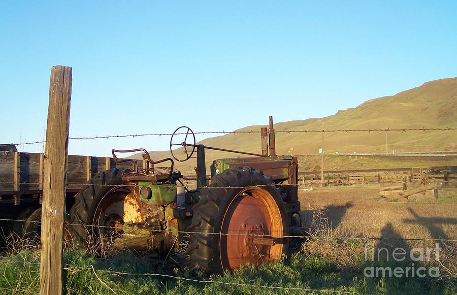 John Deere Against a Fence Photograph by Charles Robinson