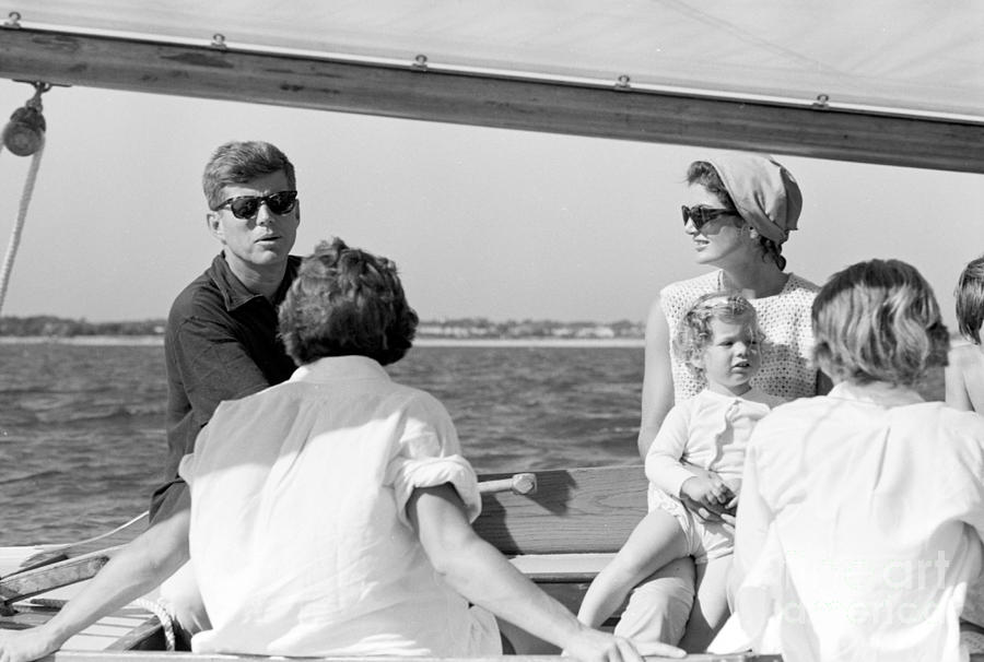 John F. Kennedy and Jacqueline sailing off Hyannis Port Photograph by The Harrington Collection