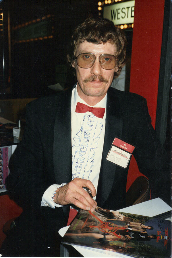 John Holmes signing autographs. is a photograph by John Holmes which was up...